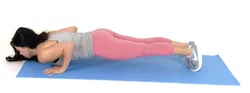 Chaturanga plank exercise being done by trainer Christina Carlyle