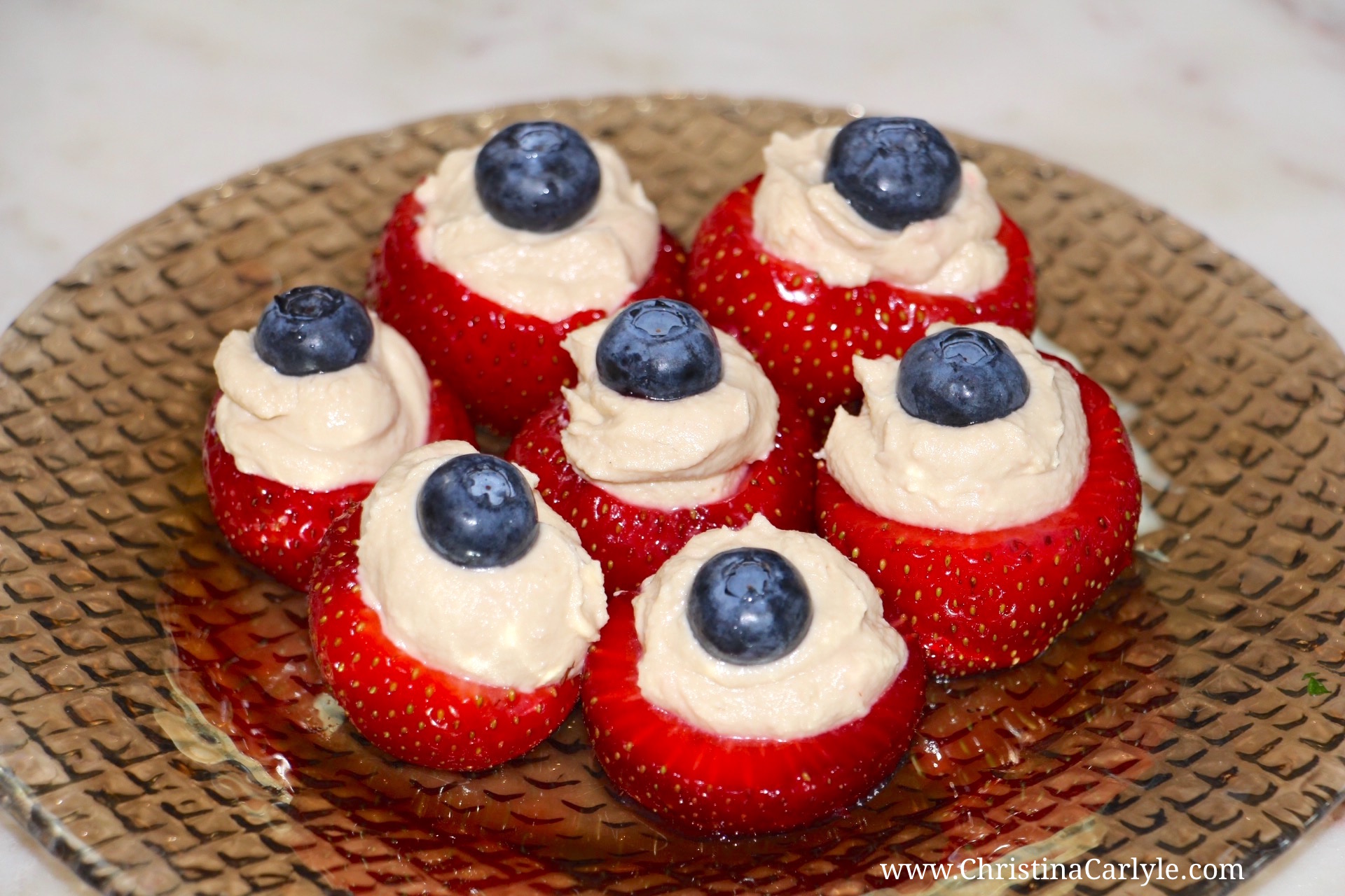 Strawberry Hummus 4th of July Appetizer Idea Red white and Blue Hummus Blueberry and Strawberry Bites Recipe | Healthy 4th of July Recipes from nutritionist Christina Carlyle https://www.christinacarlyle.com/healthy-4th-of-july-recipes/