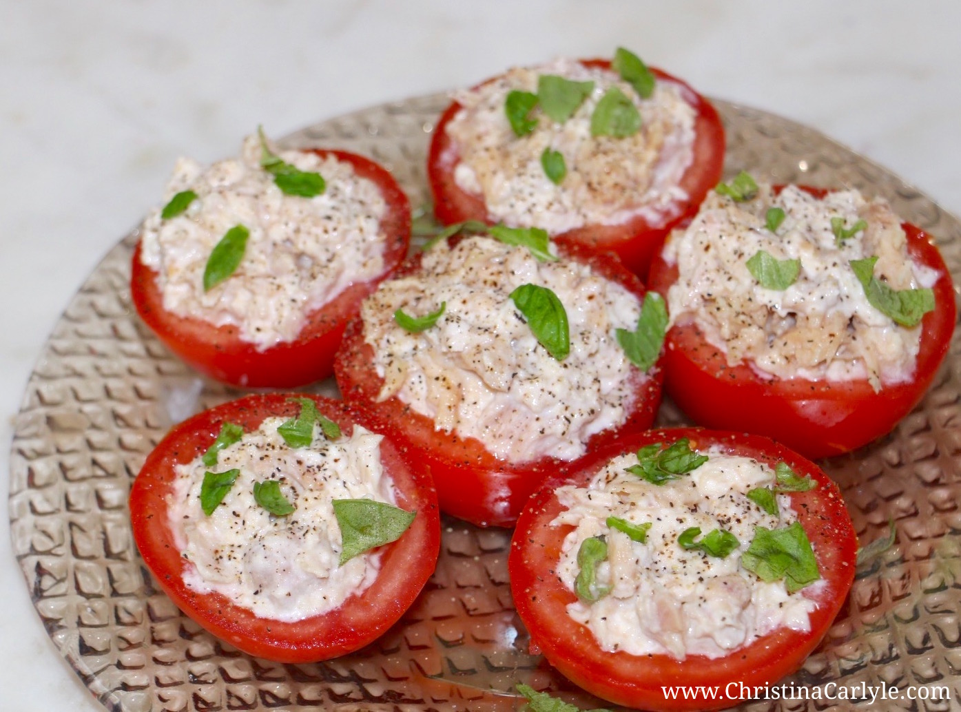 Healthy 4th of July Recipes - Healthy Tuna Stuffed Tomatoes from nutritionist Christina Carlyle. Nutritious, Delicious, and Easy Healthy 4th of July Recipes you can enjoy guilt-free. These delicious, Healthy 4th of July Recipes are high in nutrients and fiber but low in calories, fat, and sugar. https://www.christinacarlyle.com/healthy-4th-of-july-recipes