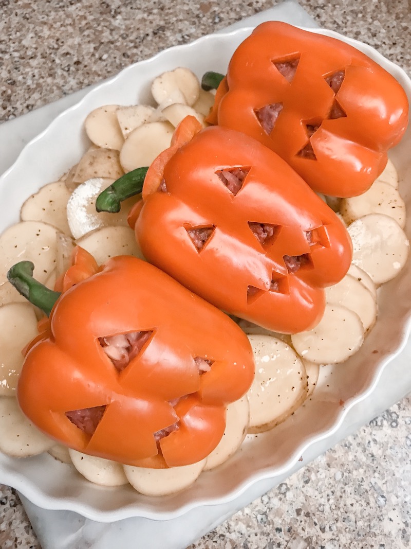 Stuffed Peppers Carved with jack O Lantern faces 