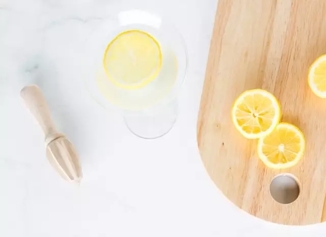 Lemon water detox ingredients on a countertop