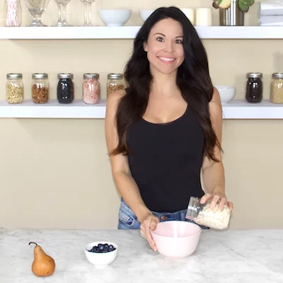 nutritionist Christina Carlyle smiling in a kitchen