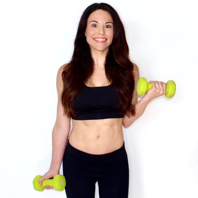 a photo of Trainer and nutritionist Christina Carlyle holding dumbbells