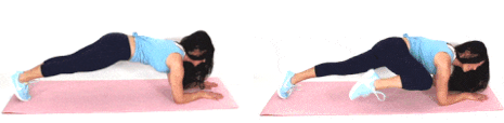 Christina Carlyle doing a tuck crunch plank ab exercise