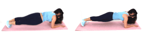 Christina Carlyle doing a hip dip ab exercise at home