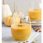 Pumpkin Smoothie on a table with mini pumpkins and gourds and text that says Pumpkin Smoothie Healthy Recipe