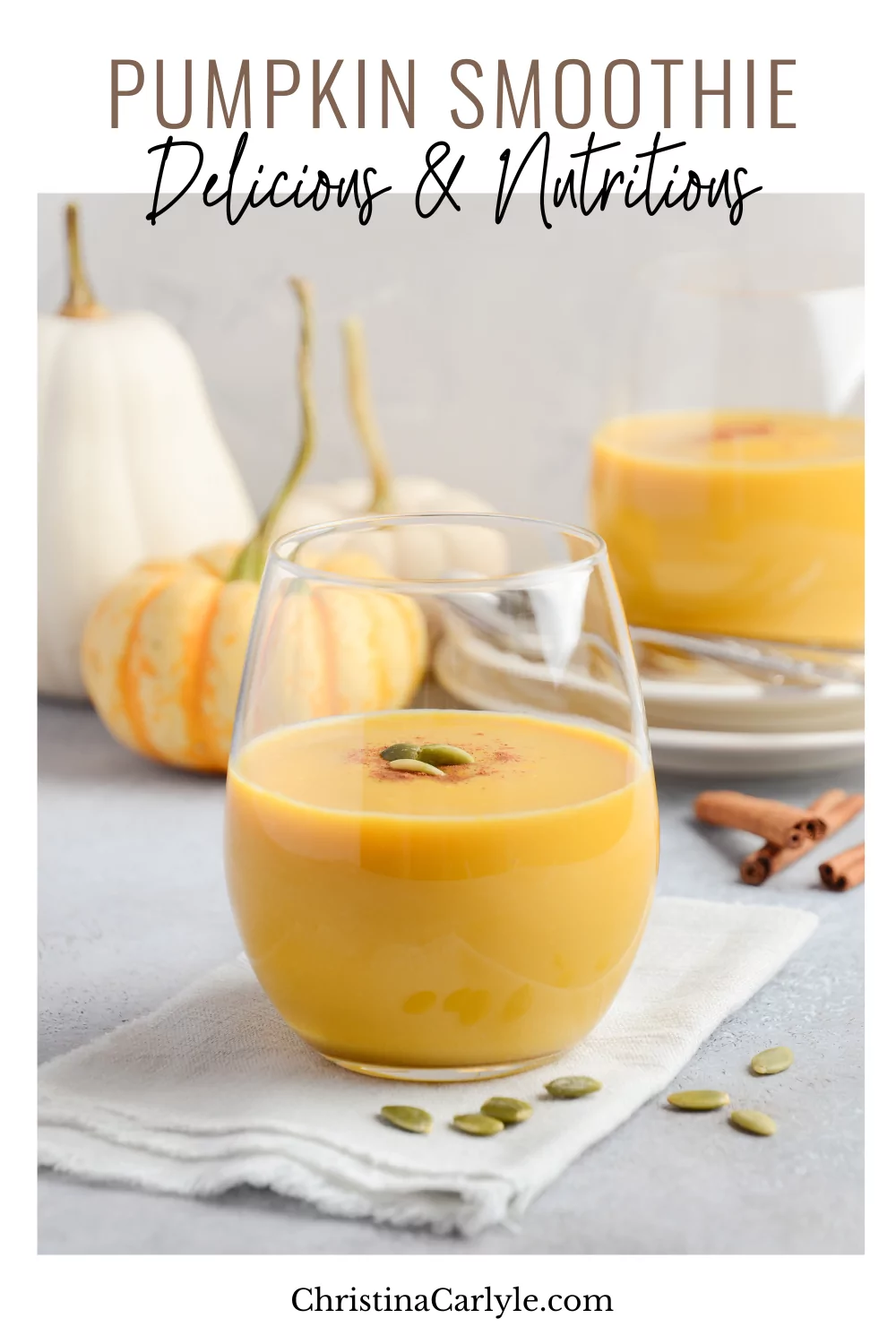 Pumpkin Smoothie on a table with mini pumpkins and gourds and text that says Pumpkin Smoothie Healthy Recipe
