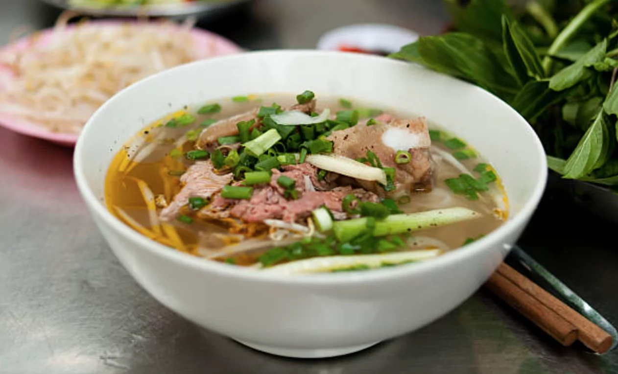 Pho Soup with a side plate with mung beans