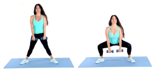 Trainer Christina Carlyle doing a Plie Squat Exercise in a 10 minute butt workout on a blue yoga mat