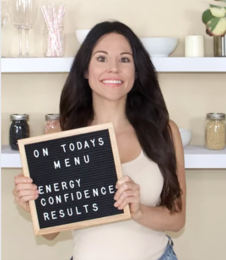 Christina Carlyle nutritionist and trainer Christina Carlyle nutritionist and trainer holding a sign that says on today's menu energy, confidence, results