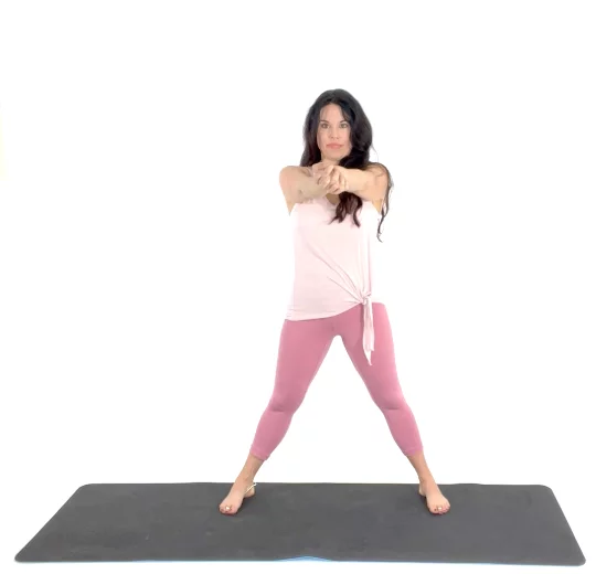 Trainer Christina Carlyle demonstrating a forearm stretch