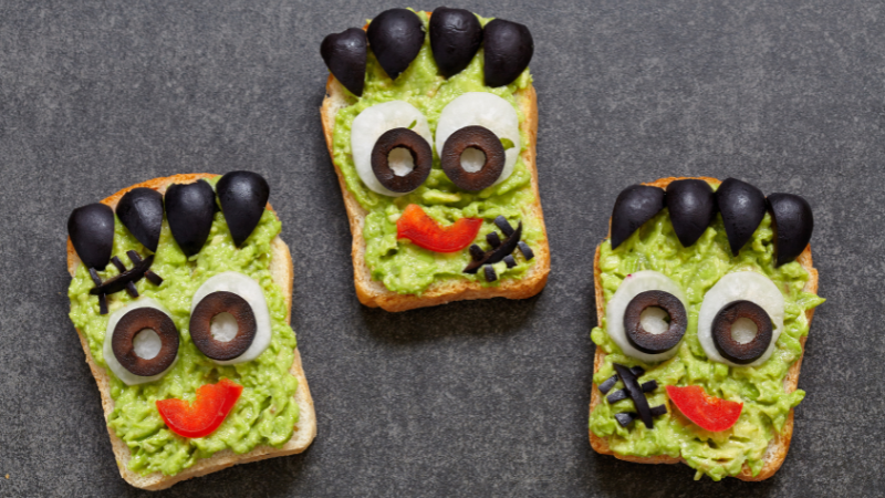 Avocado Toast with vegetables making a Monster Face for Halloween