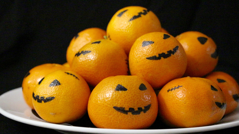 Clementines with Jack O Lantern Faces drawn on