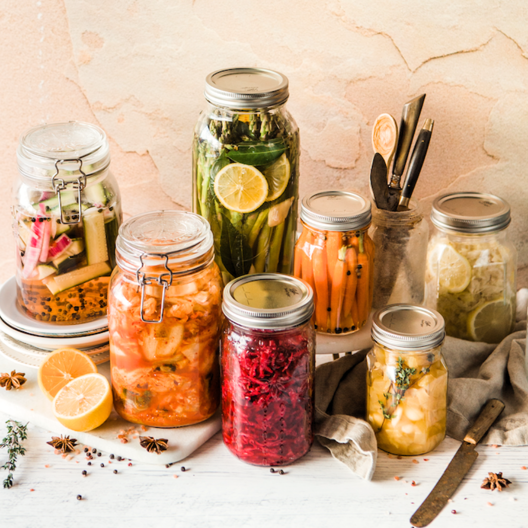different fermented vegetables in fermentation jars