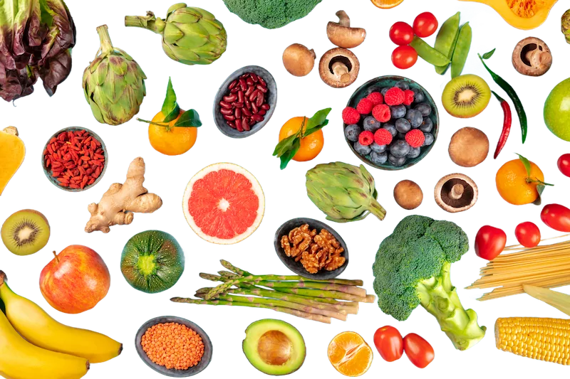 a flat lay of different high fiber fruits, vegetables, nuts, seeds, and grains 