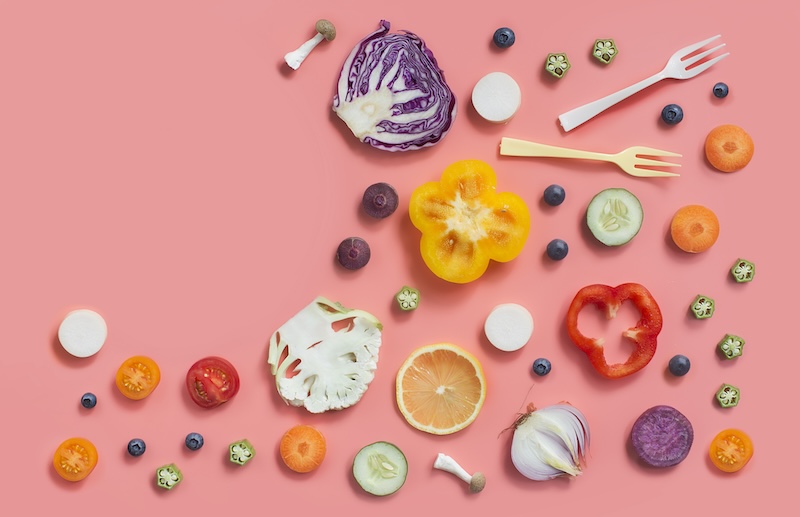 a flatlay of different fruits and vegetables that boost immunity