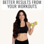 Dr Christina Carlyle smiling in a black sports bra and black leggings holding two lime green dumbbells against a light background.