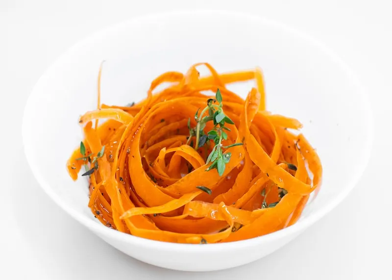Carrot Salad a bowl of carrot salad in a white bowl