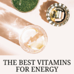 Healthy Green ULT Shake, Glass of water with lemon and bunch of daily supplements nearby. Strong shadows from the sun. Healthy summer breakfast, top view and text that says The Best Vitamins for Energy
