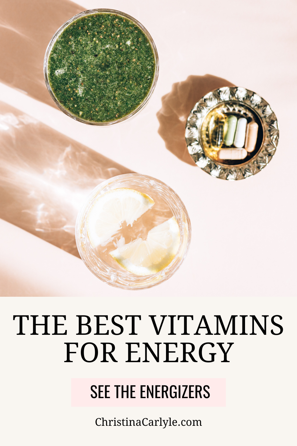 Healthy Green ULT Shake, Glass of water with lemon and bunch of daily supplements nearby. Strong shadows from the sun. Healthy summer breakfast, top view and text that says The Best Vitamins for Energy