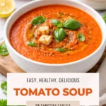 Creamy tomato soup in a white bowl topped with basil and croutons, with text overlay reading “Easy, Healthy, Delicious Tomato Soup” and “Dr. Christina Carlyle.”