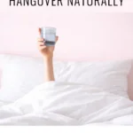 Dr. Christina Carlyle blog graphic showing how to cure a hangover naturally with a hand holding water in bed and a read more call to action