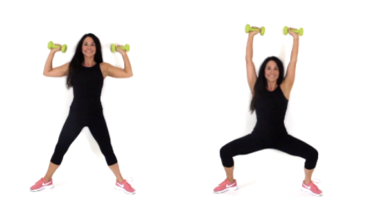 Dr. Christina Carlyle demonstrates plie and press with dumbbells, lowering into a wide squat while pressing the weights overhead.