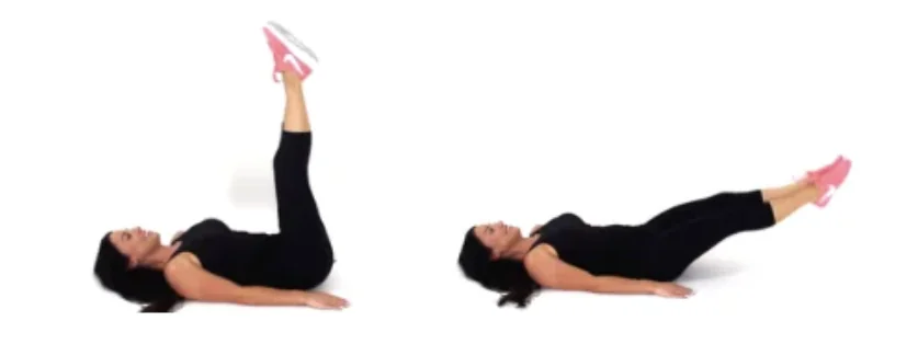 Dr. Christina Carlyle demonstrating lying leg lifts for a core calisthenics workout.
